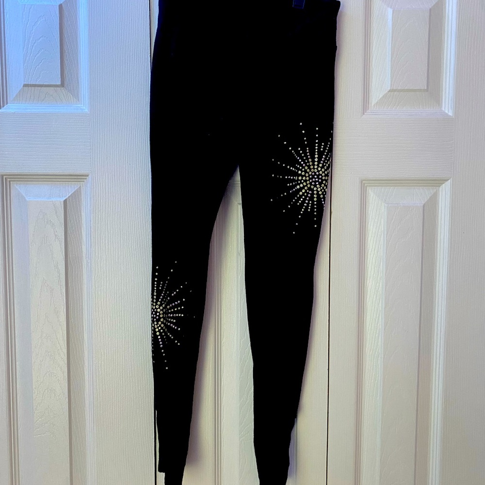 Justice Black leggings w/starburst embellishments. Lattice detail ankle. Size 12